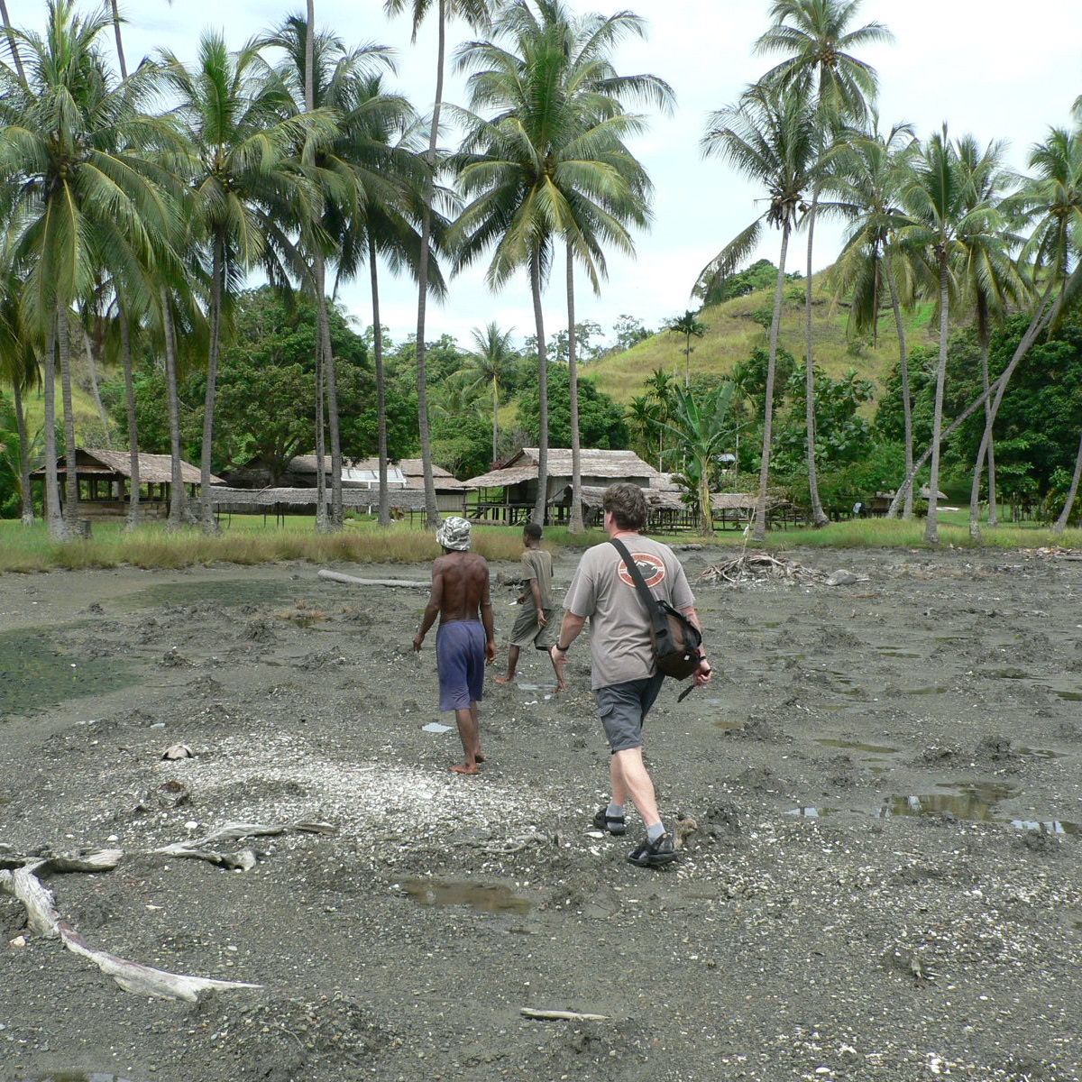 Here I am hoofing it into a village, Collingwood Bay April 2007, notice the lime spatula in my right hand.  Photo by Greg Hamson.