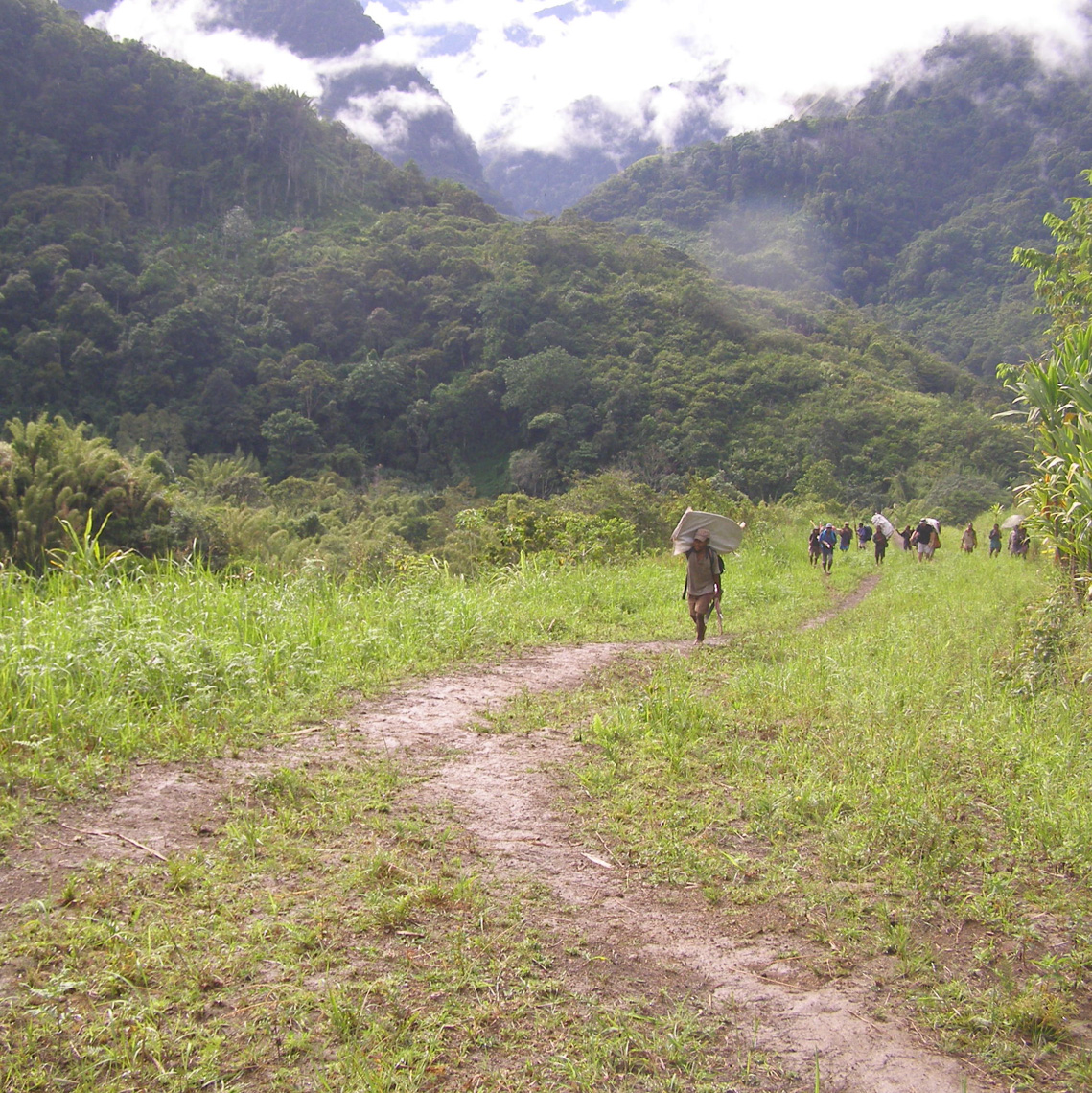 Entering a New Guinea Village, Morobe Province.