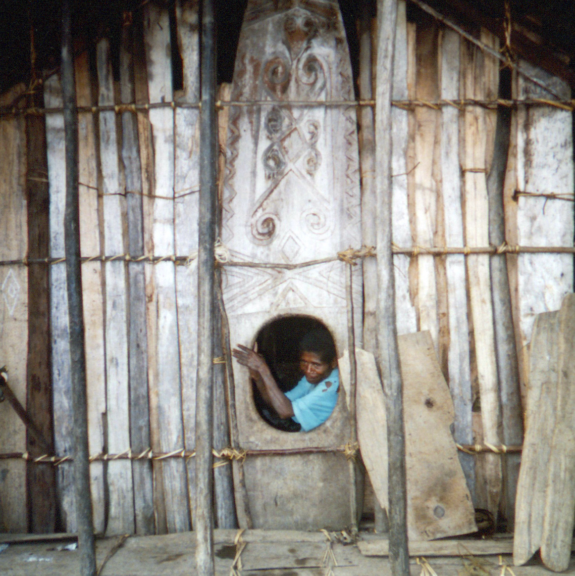 Old Telefomin doorboard, amitung, still in use.  Creates a secure, warm interior in this high mountain valley, West Sepik Province, Papua New Guinea, circa 2004/5.